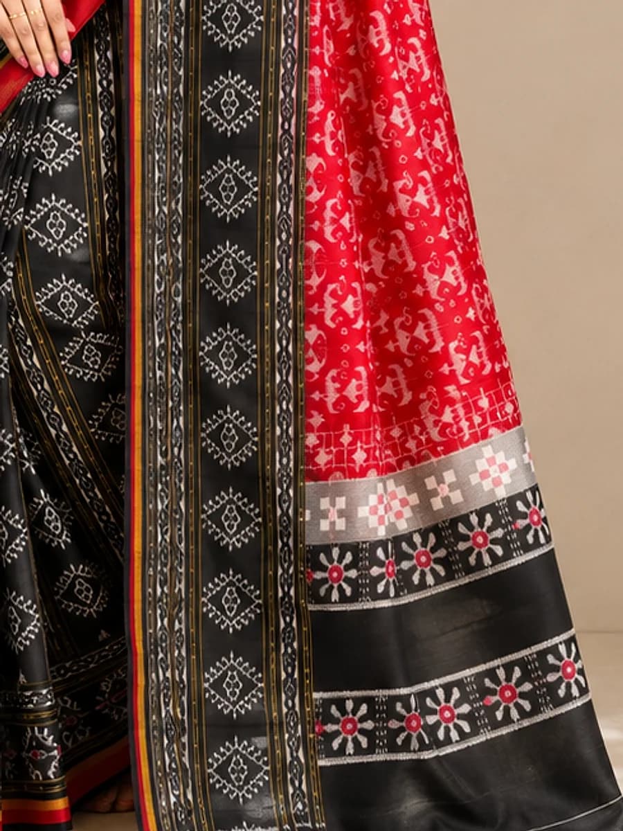 Close-up of black and scarlet Sambalpuri bandha weave, Handloom Garden Puri